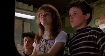 Movie still from “The Wizard” (1989), directed by Todd Holland – A group of young people standing next to each other in a room; Close Up shot, Low angle