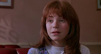 Movie still from “The Wizard” (1989), directed by Todd Holland – A person with long red hair; Close Up shot, Over the shoulder angle