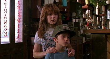 Movie still from “The Wizard” (1989), directed by Todd Holland – A young girl and a young boy standing next to each other; Close Up shot, Over the shoulder angle