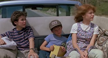 Movie still from “The Wizard” (1989), directed by Todd Holland – A group of people sitting in the back of a car; Medium shot, Low angle
