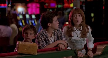 Movie still from “The Wizard” (1989), directed by Todd Holland – A group of young people sitting next to each other; Medium shot, Low angle