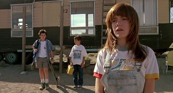 Movie still from “The Wizard” (1989), directed by Todd Holland – Three young people standing in front of a building; Medium shot, Low angle