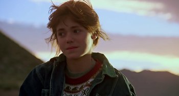 Movie still from “The Wizard” (1989), directed by Todd Holland – A young woman with brown hair wearing a jacket; Close Up shot, Over the shoulder angle