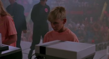 Movie still from “The Wizard” (1989), directed by Todd Holland – A young boy is playing a video game; Medium shot, Low angle