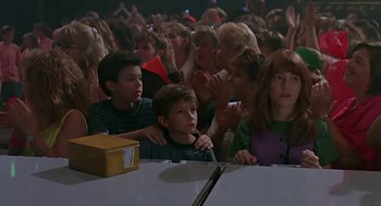Movie still from “The Wizard” (1989), directed by Todd Holland – A group of people sitting in a room; Medium shot, High angle