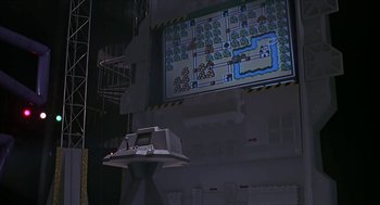 Movie still from “The Wizard” (1989), directed by Todd Holland – A video game is projected onto a wall; Wide shot, High angle