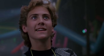 Movie still from “The Wizard” (1989), directed by Todd Holland – A young man looking up into the air; Close Up shot, Low angle