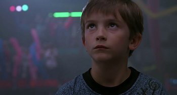 Movie still from “The Wizard” (1989), directed by Todd Holland – A young boy looking up into the air; Close Up shot, Low angle