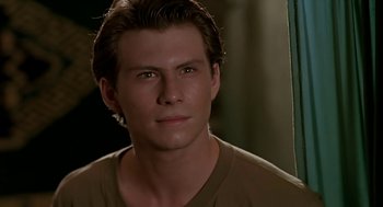 Movie still from “The Wizard” (1989), directed by Todd Holland – A person wearing a brown t - shirt; Close Up shot, High angle