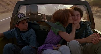 Movie still from “The Wizard” (1989), directed by Todd Holland – A group of people sitting in the back of a car; Medium shot, Over the shoulder angle