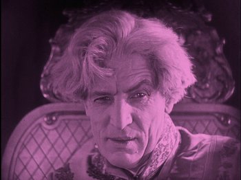 Movie still from “The Wizard of Oz” (1925), directed by Larry Semon – An older man with a strange look on his face; Close Up shot, Low angle