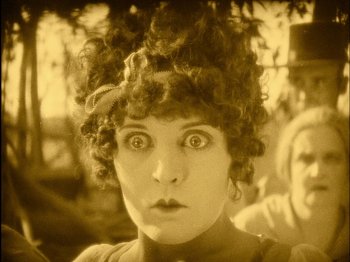 Movie still from “The Wizard of Oz” (1925), directed by Larry Semon – An old photo of a woman with a strange look on her face; Extreme Close Up shot, High angle