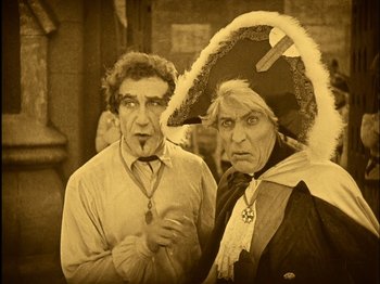 Movie still from “The Wizard of Oz” (1925), directed by Larry Semon – A man and a woman dressed up as pirates; Medium shot, High angle