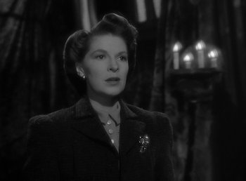 Movie still from “The Wolf Man” (1941), directed by George Waggner – An old photo of a woman in a black suit; Close Up shot, Low angle