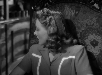 Movie still from “The Wolf Man” (1941), directed by George Waggner – A black and white photo of a woman in a chair; Close Up shot, High angle