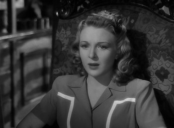 Movie still from “The Wolf Man” (1941), directed by George Waggner – An old black and white photo of a woman; Close Up shot, High angle