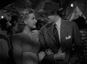 Movie still from “The Wolf Man” (1941), directed by George Waggner – A man and a woman standing next to each other; Medium shot, High angle