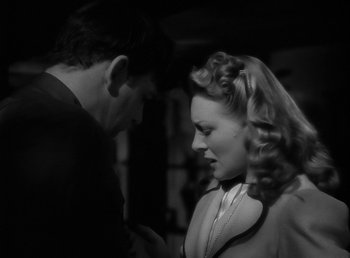Movie still from “The Wolf Man” (1941), directed by George Waggner – A man and a woman looking at one another; Close Up shot, Over the shoulder angle