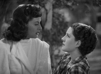 Movie still from “The Women” (1939), directed by George Cukor – Two young women are talking to each other; Close Up shot, High angle