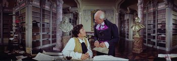 Movie still from “The Wonderful World of the Brothers Grimm” (1962), directed by Henry Levin – A man and a woman in a room; Medium shot, Over the shoulder angle