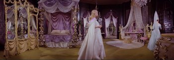 Movie still from “The Wonderful World of the Brothers Grimm” (1962), directed by Henry Levin – A woman dressed in a long white dress; Wide shot, High angle