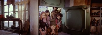 Movie still from “The Wonderful World of the Brothers Grimm” (1962), directed by Henry Levin – A group of children dressed up in costumes; Medium shot, High angle