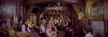 Movie still from “The Wonderful World of the Brothers Grimm” (1962), directed by Henry Levin – A group of children sitting in a room; Wide shot, High angle