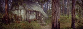 Movie still from “The Wonderful World of the Brothers Grimm” (1962), directed by Henry Levin – A man sitting in front of a hut in the woods; Wide shot, High angle