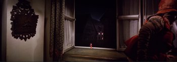 Movie still from “The Wonderful World of the Brothers Grimm” (1962), directed by Henry Levin – A toy fire hydrant sitting in front of an open window at night; Extreme Wide shot, High angle