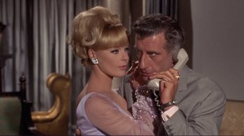 Movie still from “The Wrecking Crew” (1968), directed by Phil Karlson – A man and a woman on the phone; Close Up shot, Low angle