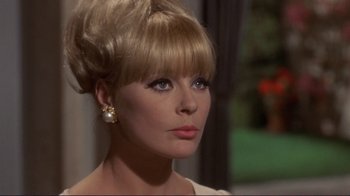 Movie still from “The Wrecking Crew” (1968), directed by Phil Karlson – A person wearing a dress; Close Up shot, Over the shoulder angle