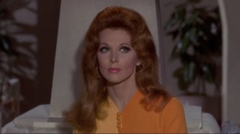 Movie still from “The Wrecking Crew” (1968), directed by Phil Karlson – A person with long hair; Close Up shot, Over the shoulder angle