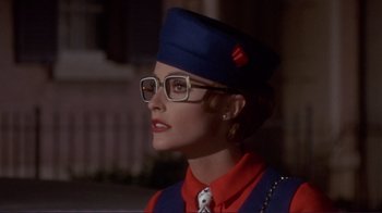 Movie still from “The Wrecking Crew” (1968), directed by Phil Karlson – A woman wearing a blue hat and glasses; Close Up shot, Low angle