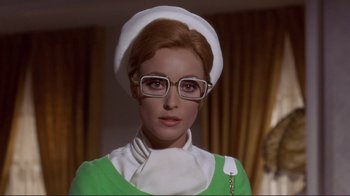 Movie still from “The Wrecking Crew” (1968), directed by Phil Karlson – A person wearing glasses and a hat; Close Up shot, Low angle