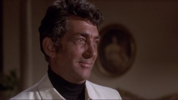 Movie still from “The Wrecking Crew” (1968), directed by Phil Karlson – A person wearing a suit and tie; Close Up shot, Low angle