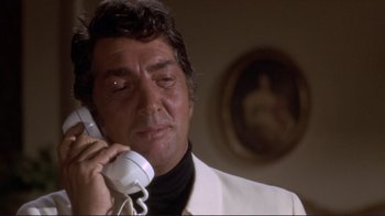 Movie still from “The Wrecking Crew” (1968), directed by Phil Karlson – A person talking on a phone; Close Up shot, Low angle