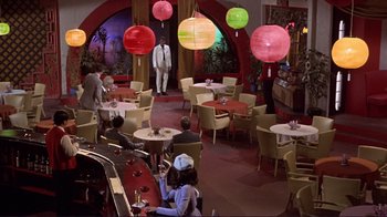 Movie still from “The Wrecking Crew” (1968), directed by Phil Karlson – People are sitting at tables in a restaurant; Extreme Wide shot, High angle