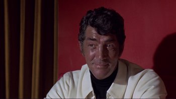 Movie still from “The Wrecking Crew” (1968), directed by Phil Karlson – A person wearing a white shirt; Close Up shot, Over the shoulder angle