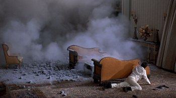 Movie still from “The Wrecking Crew” (1968), directed by Phil Karlson – Smoke billows out of a fireplace in a living room; Wide shot, High angle
