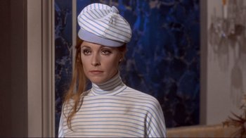 Movie still from “The Wrecking Crew” (1968), directed by Phil Karlson – A person wearing a hat; Medium shot, Low angle