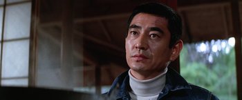 Movie still from “The Yakuza” (1974), directed by Sydney Pollack – A person wearing a jacket; Close Up shot, Low angle