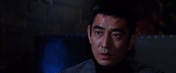 Movie still from “The Yakuza” (1974), directed by Sydney Pollack – A person wearing a jacket; Close Up shot, Low angle