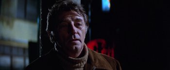 Movie still from “The Yakuza” (1974), directed by Sydney Pollack – A person wearing a brown jacket; Close Up shot, Low angle