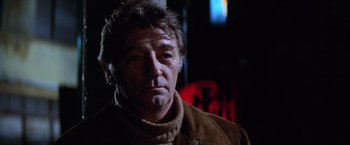 Movie still from “The Yakuza” (1974), directed by Sydney Pollack – A person wearing a jacket; Close Up shot, Low angle