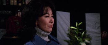 Movie still from “The Yakuza” (1974), directed by Sydney Pollack – A person wearing a blue jacket; Close Up shot, Over the shoulder angle