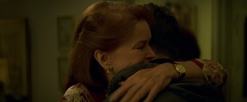 Movie still from “The Yards” (2000), directed by James Gray – A person hugging another person; Close Up shot, Over the shoulder angle