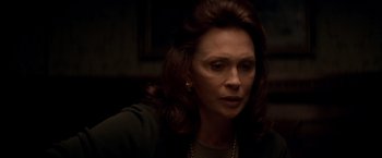 Movie still from “The Yards” (2000), directed by James Gray – A person wearing a necklace; Close Up shot, Over the shoulder angle