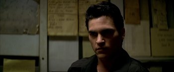 Movie still from “The Yards” (2000), directed by James Gray – A person wearing a black shirt; Close Up shot, Over the shoulder angle