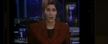 Movie still from “The Yards” (2000), directed by James Gray – A woman wearing a red jacket is talking to the camera; Close Up shot, Low angle