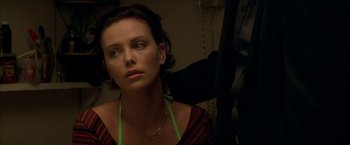 Movie still from “The Yards” (2000), directed by James Gray – A person wearing a necklace; Close Up shot, Over the shoulder angle